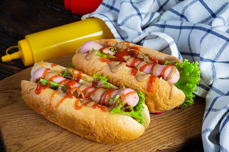 delicious-hot-dog-with-ketchup-and-mustard-on-wood-2022-03-16-18-47-49-utc.jpg
